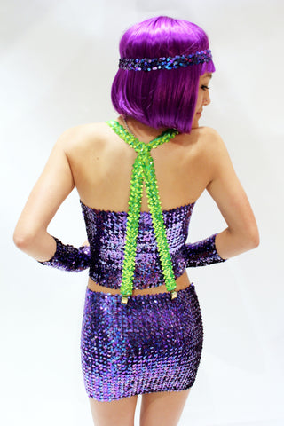 Our model is wearing the sequins suspenders in Neon Green.