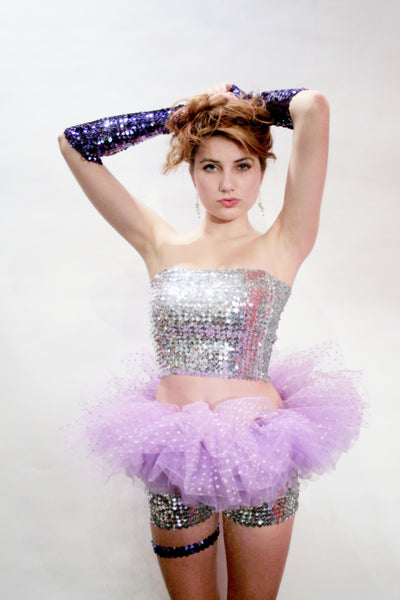 Our model is wearing the Short Sequins Tube Top in Silver.