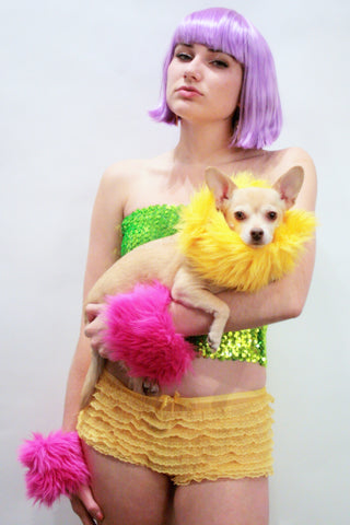 Our models are wearing the fur cuffs in Yellow and Fuchsia.