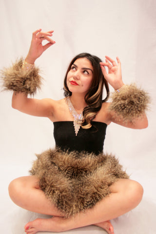 Our model is wearing the High-End Fur Cuffs in Lemur.
