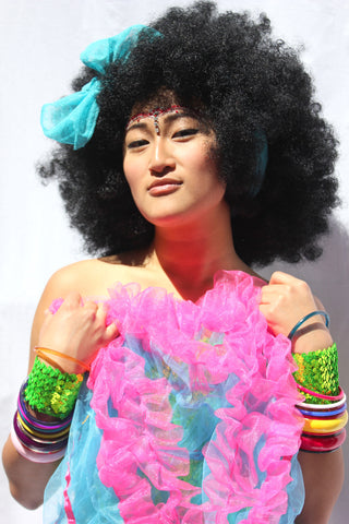 Our model is wearing the Black Afro Wig.