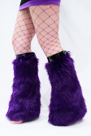 Our model is wearing the Fur Leg Warmers in Purple.