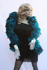 Our model is wearing the Rooster Feather Boa in the Turquoise Saddle Hackle.