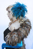 Our model is wearing the Fierce Rooster Hairclip in Turquoise Saddle Hackle.
